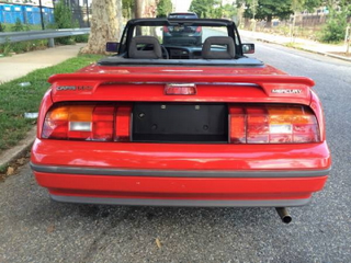 Illustration for article titled For $1,900, This 1991 Mercury Capri Puts The Top Down On Fun
